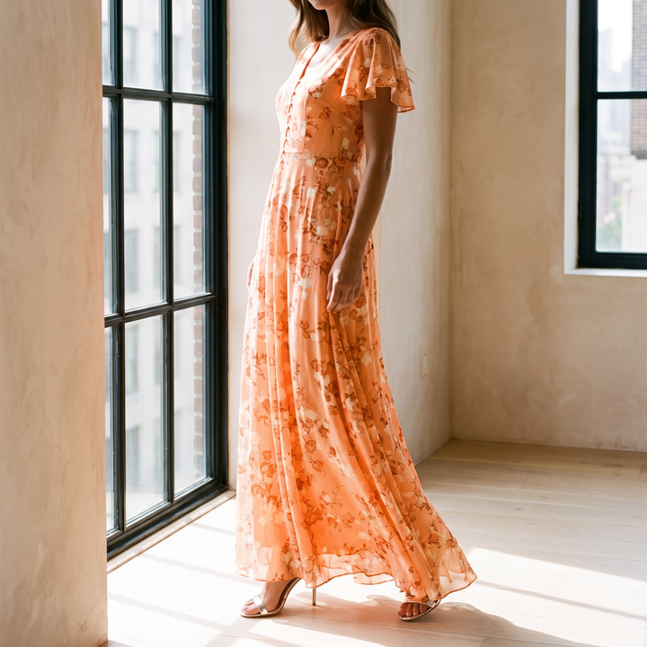 Aurelia maxi dress by a tall apartment window