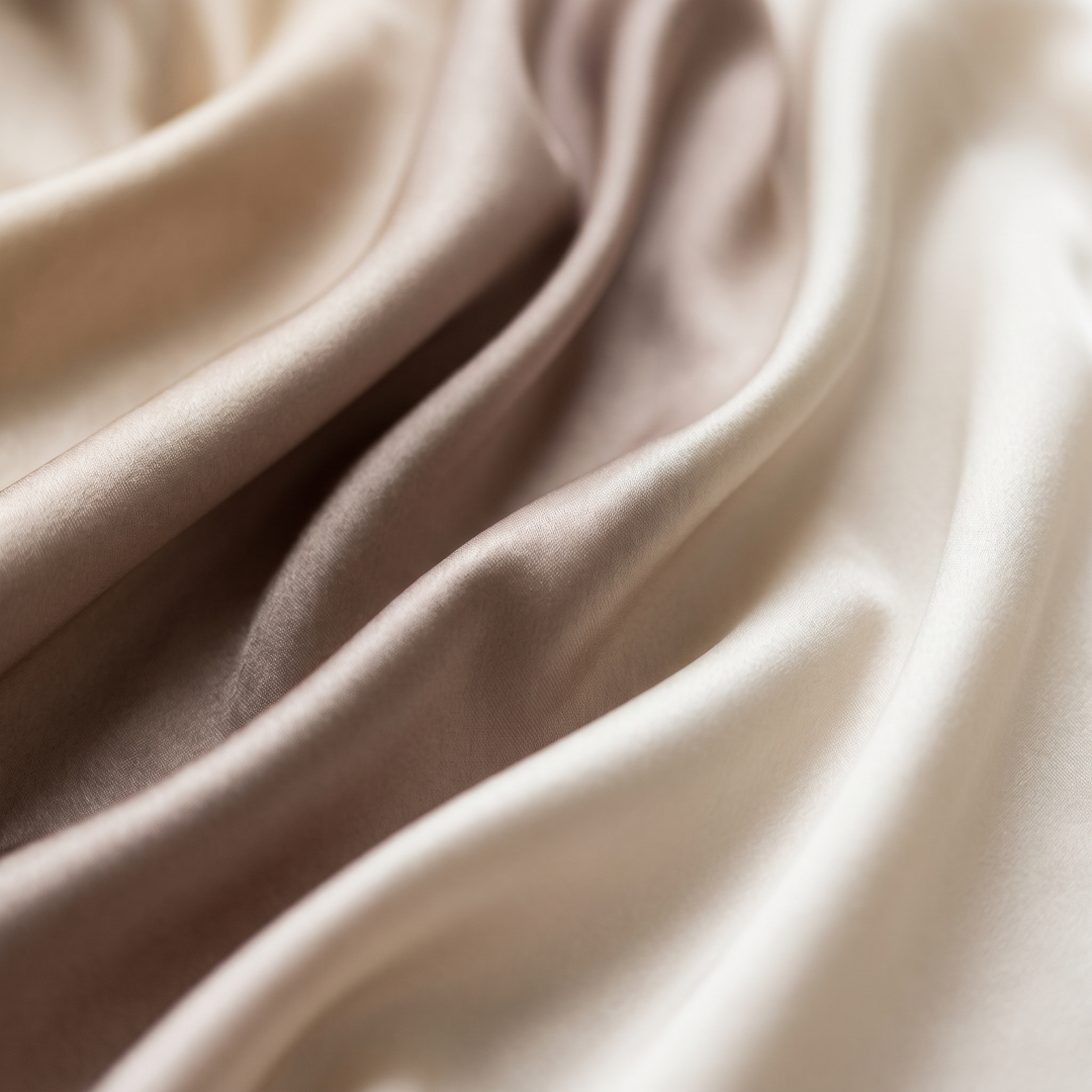 Close up of champagne silk satin in soft folds