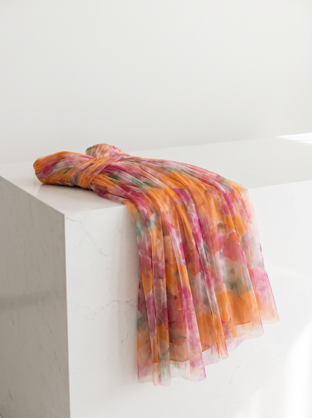 Valerie dress folded over a white counter